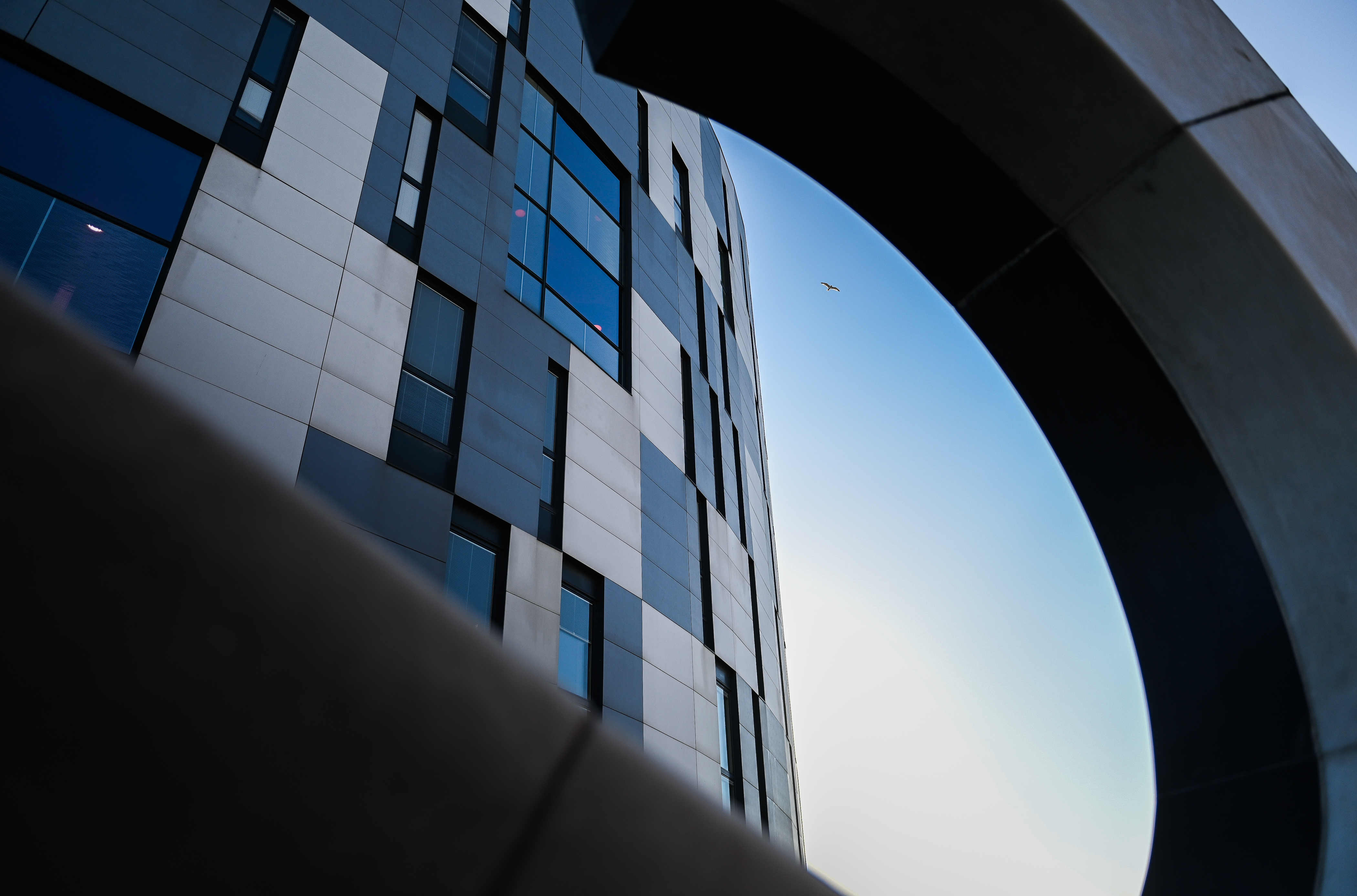 Waterfront Building through the question mark statue