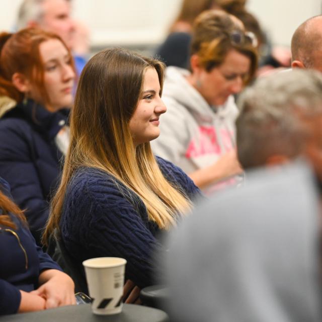 Parents and students sitting in a lecture theatre